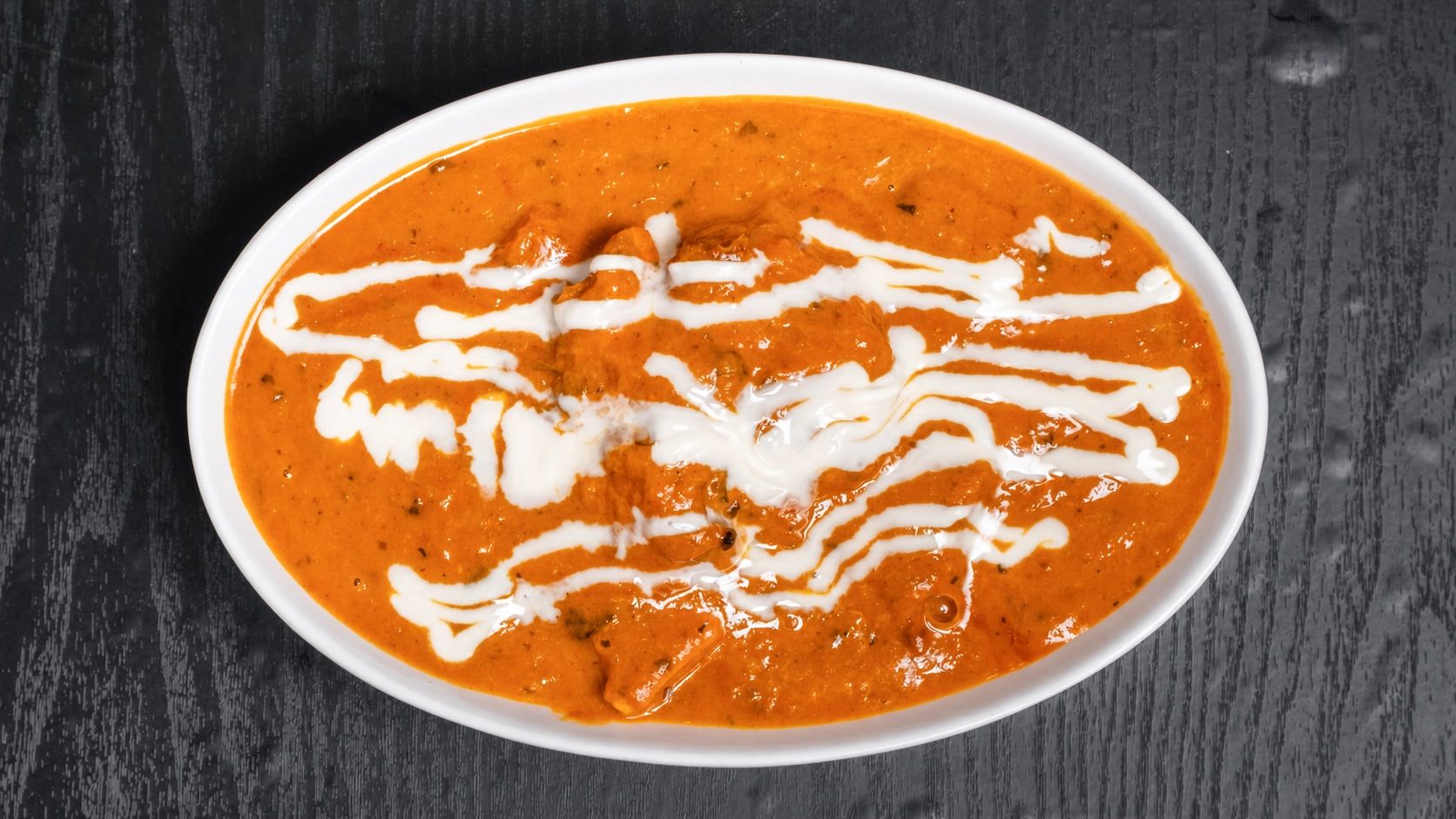 Butter Chicken with cream drizzle at Tandoor and Chai Indian Pakistani restaurant Bedford Perth