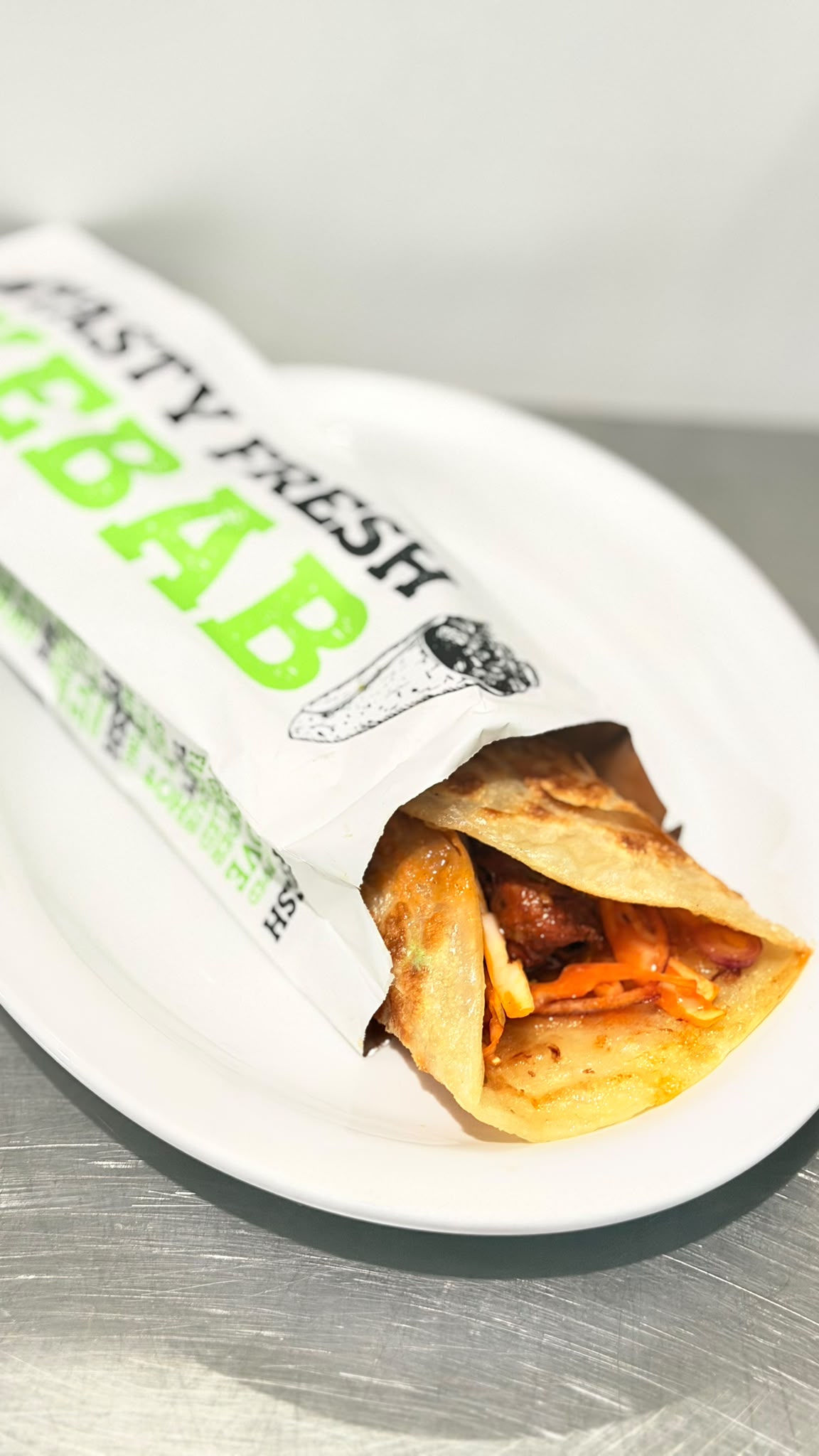 Tasty fresh kebab wrap in branded packaging at Tandoor and Chai Bedford Perth